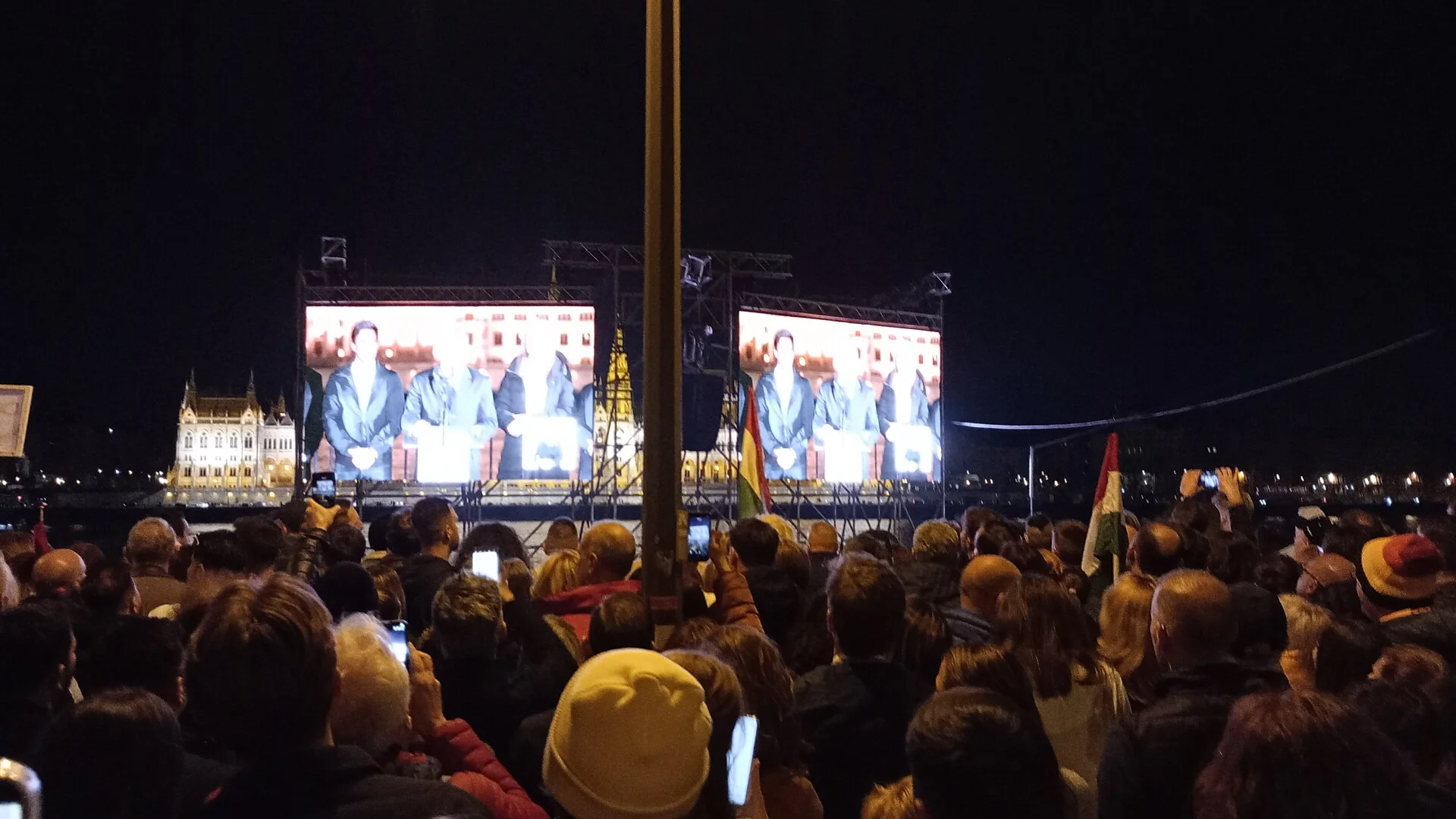 Budapest Bem Rakpart near Csalogány u., during Péter Magyar's 2026 victory speech, livestreamed on large video displays